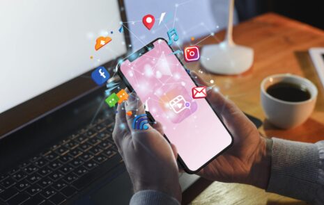 hands-holding-smartphone-social-media-concept-min